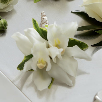 White Mini Cymbidium Boutonniere –  Rhodes Family Price Chopper, Branson MO